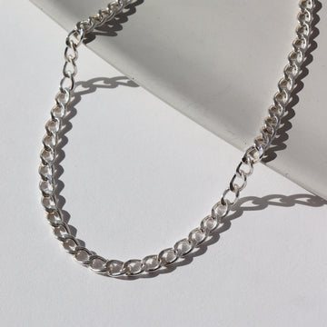 925 sterling silver curb chain anklet photographed on a white backdrop