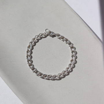 bold curb chain bracelet in 925 sterling silver with lobster clasp and half inch extender chain to make the bracelet adjustable