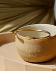 hammered gold cuff bracelet handcrafted by Token Jewelry in Eau Claire, Wisconsin