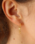Dainty 14k gold filled chain links in in lace pattern attached to post earring and backing. Chain stud earrings, Modern Earrings handmade by Token Jewelry in Eau Claire, WI