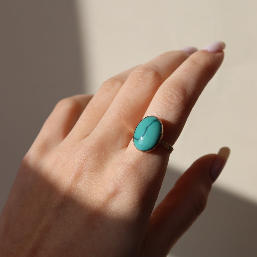 Model Wearing 14k gold fill Turquoise Nomad Ring. In the sunlight.
