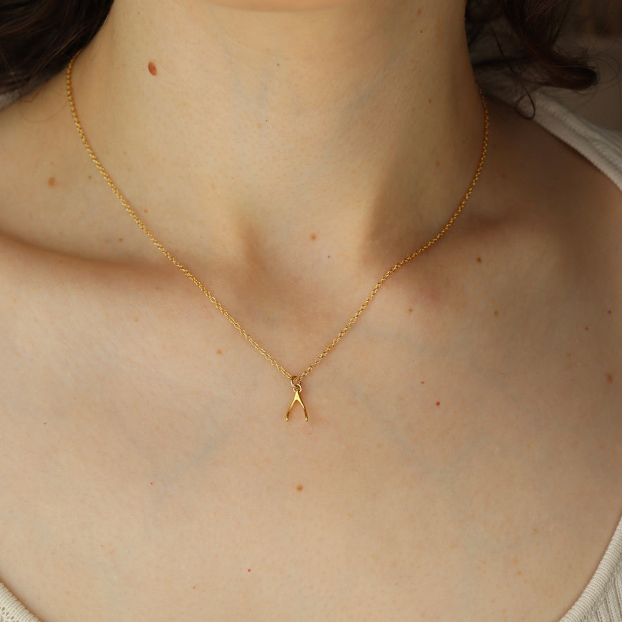 Model wearing 14k gold fill Wishbone Necklace.