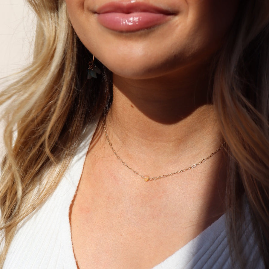 model wearing 14k gold fill Frankie Opal Necklace. This Necklace features our Clara chain with the Opal ball bead.