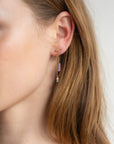 model wearing 14k gold fill chain drop earrings with gemstone beads