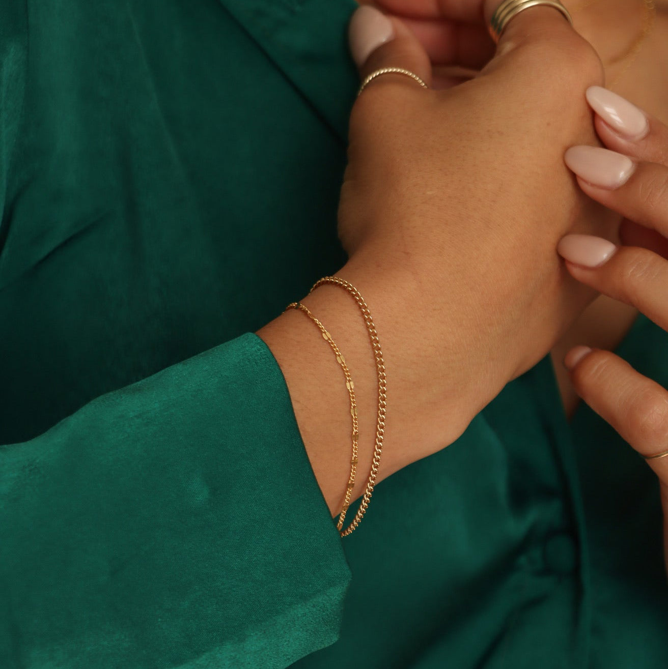 model wearing 14k gold fill bracelets 