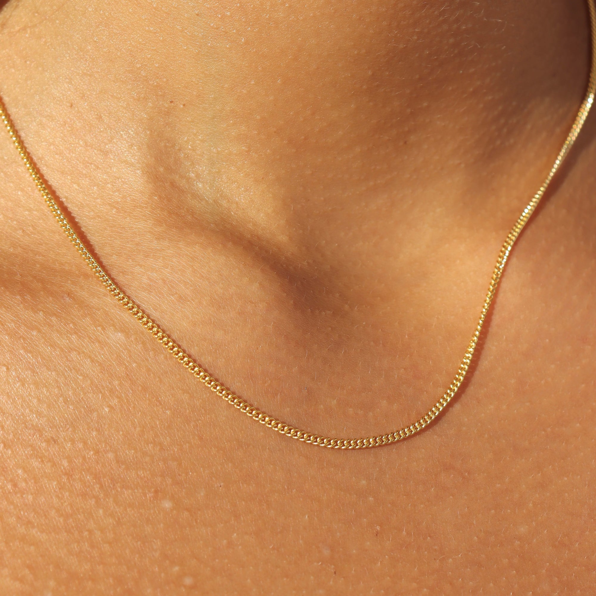14k gold fill chain necklace on a model