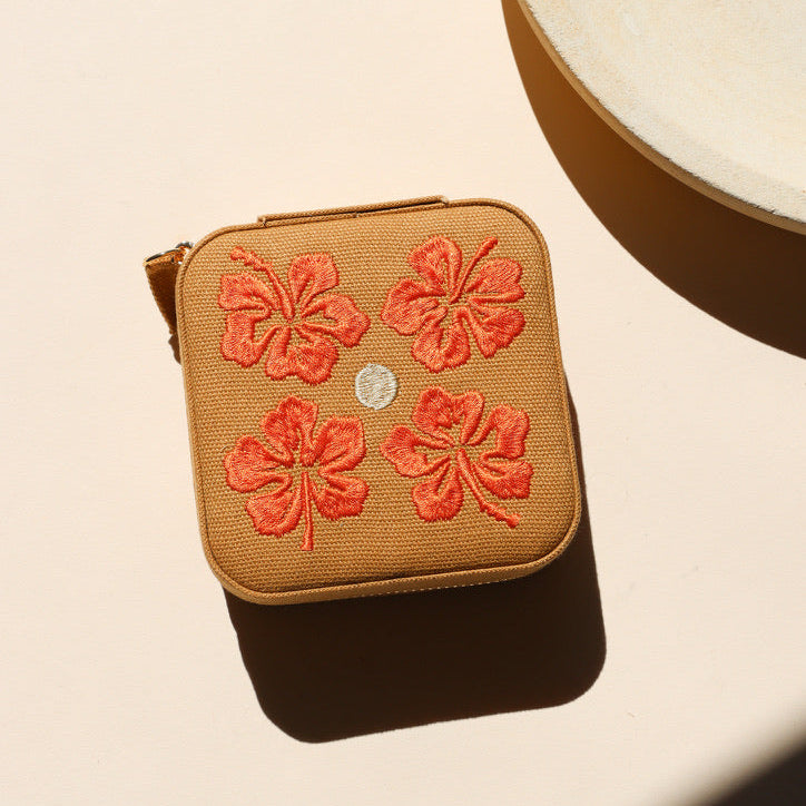 square travel jewelry case on a light background