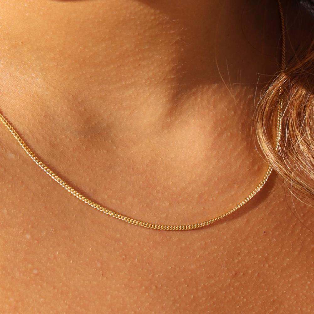 Makara Chain by Token Jewelry in 14k gold fill, close up photographed on a model