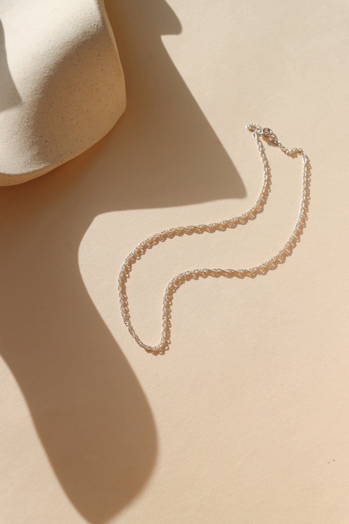 sterling silver chain necklace in the sunlight