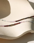 Moonwake Necklace featuring fluorite, golden obsidian, and garnet beads in rich twilight tones