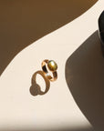 Textured gold floral band ring with bezel-set labradorite stone