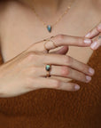 Textured gold floral band ring with bezel-set labradorite stone