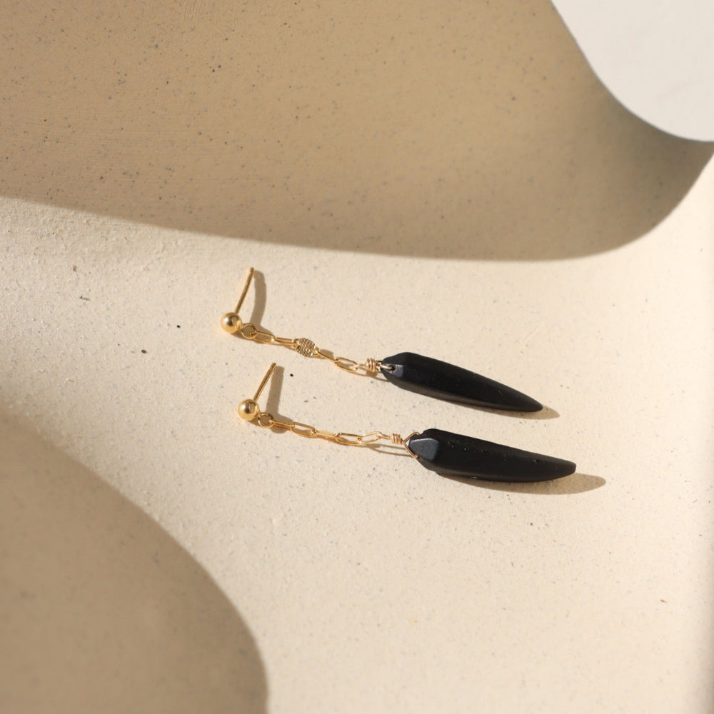 Onyx Drops featuring matte claw-shaped onyx stones suspended from polished gold fill chain and ball posts