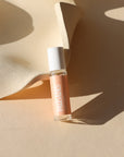 light pink perfume roller bottle in the sunligth - scent Palisades