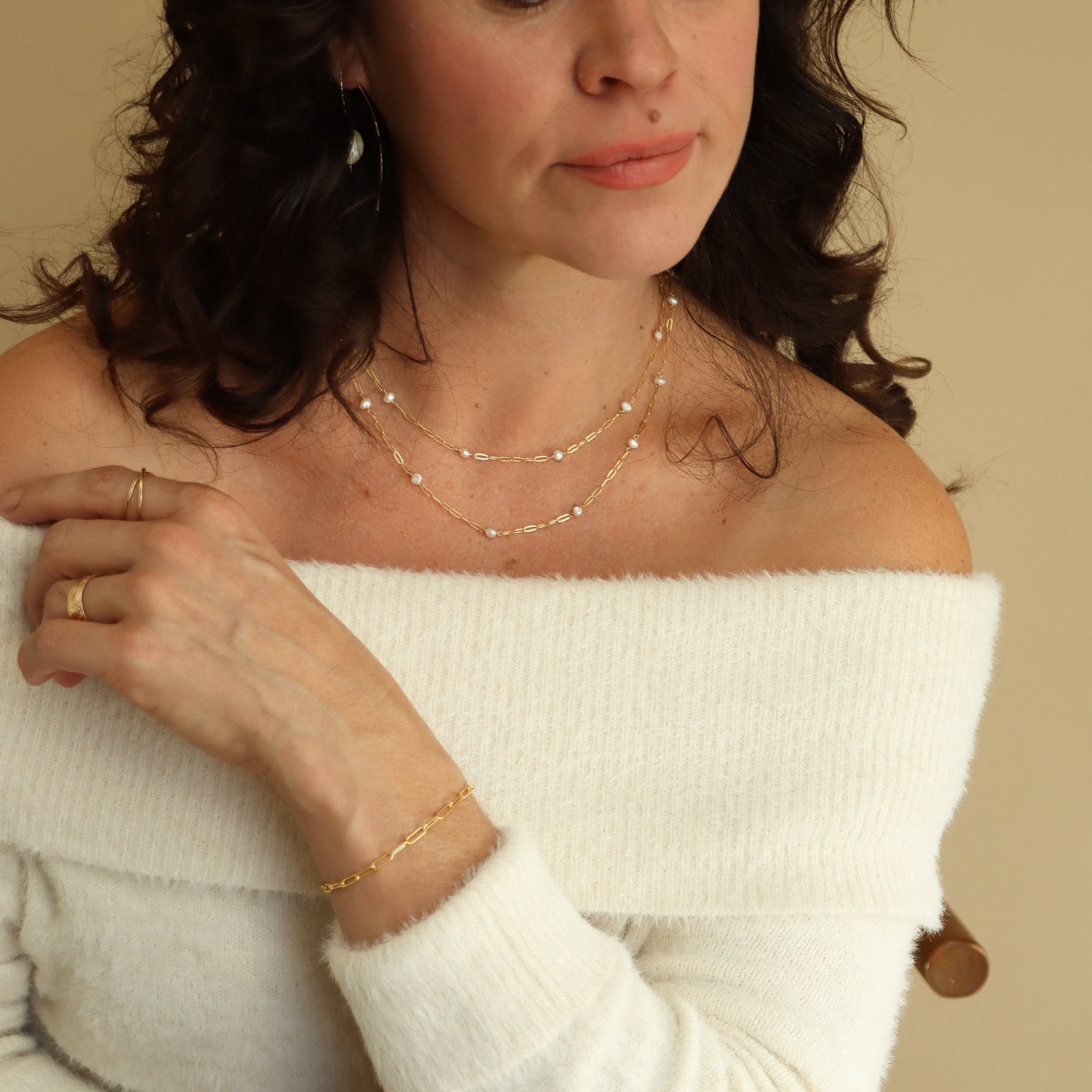 Gold Cosette chain necklace accented with a single lustrous freshwater pearl.