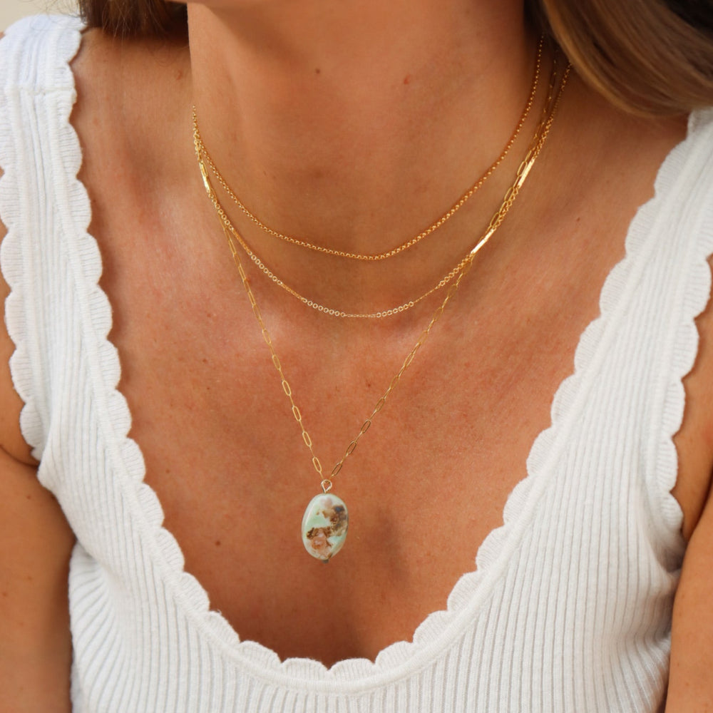 Sea Drift Necklace with unique terra agate gemstone pendant on delicate paperclip chain in gold fill, shown layered with other necklaces.