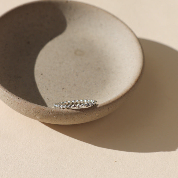 sterling silver sequin ring on a little dish