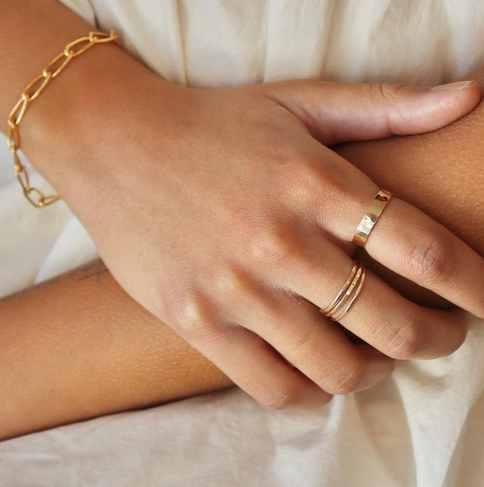 14k gold fill skinny rings stacked together paired with a 14k gold fill cigar band ring