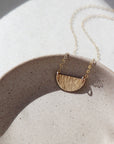 textured half-moon style necklace handmade by Token Jewelry in Eau Claire, Wisconsin
