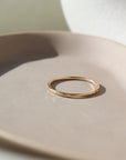 lightly hammered gold stacking ring, handmade by Token Jewelry in Eau Claire, Wisconsin