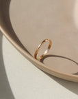 smooth circular ring in 14k gold or sterling silver, handmade by Token Jewelry in Eau Claire, Wisconsin