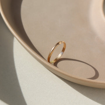 smooth circular ring in 14k gold or sterling silver, handmade by Token Jewelry in Eau Claire, Wisconsin