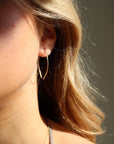 model wearing 14k gold fill  petal slide earrings