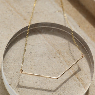 Modern geometric necklace hand hammered in 14k gold fill or sterling silver. Handmade by Token Jewelry in Eau Claire, WI  Edit alt text