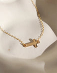 gold delicate cross chain necklace handmade in Eau Claire, Wisconsin by Token Jewelry