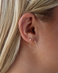 Half circle threader earring made from 14k gold fill or sterling silver. Handmade by Token Jewelry in Eau Claire, WI