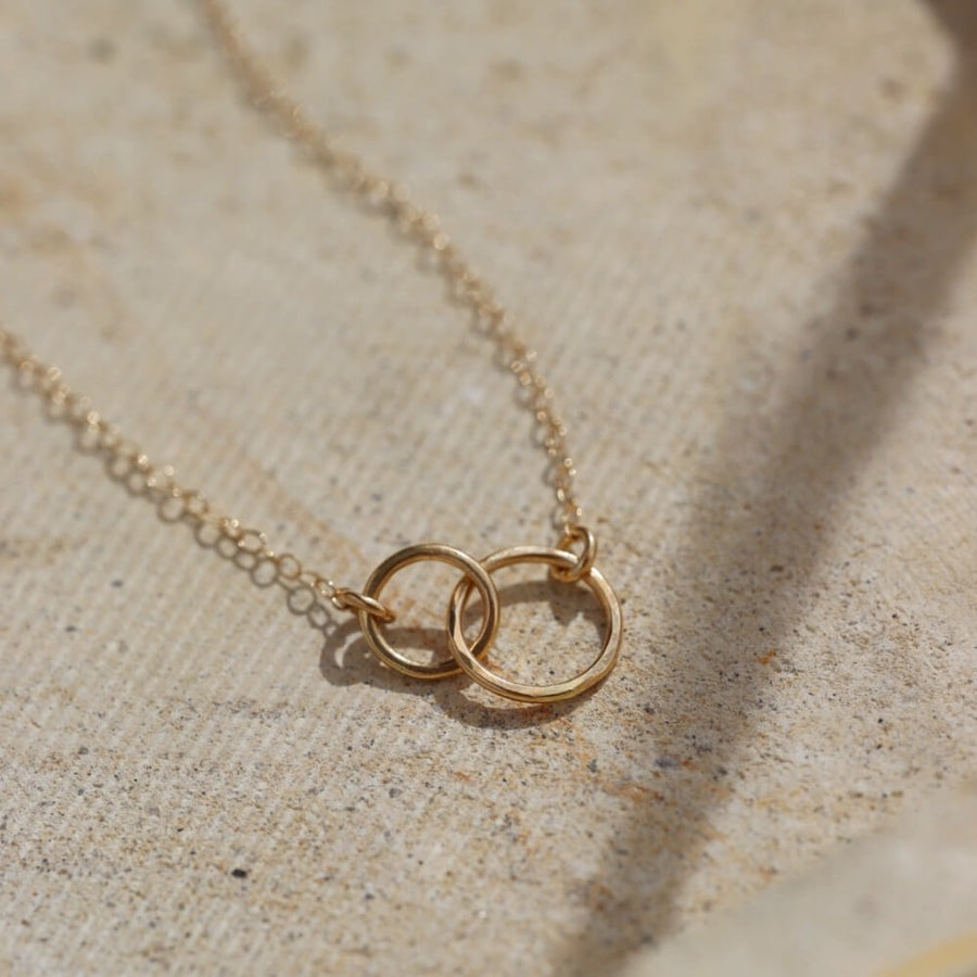 14k solid gold. An heirloom you'll pass along in your family through generations, token jewelry heirloom collection, solid gold, timeless, everyday jewelry, solid gold unity necklace, classic, handmade, made in eau claire, wisconsin, USA, woman owned business, small business