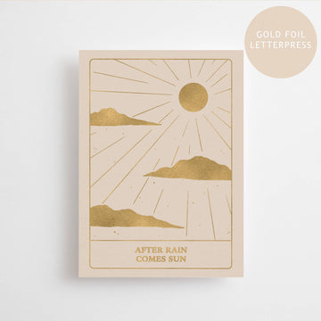 A card with a sun shining along with cloud  on the bottom of the card it says "after the rain comes the sun."